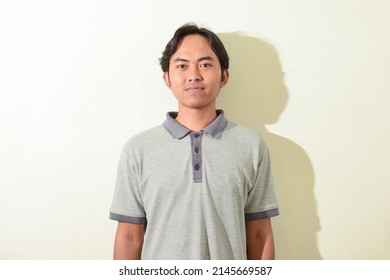 portrait of an Indonesian man. An Asian man's smiling or cheerful facial expression. portrait of indonesian people on white background isolated - Shutterstock ID 2145669587