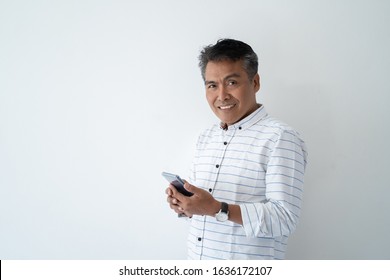 Portrait Of Indonesian Mature Asian Businessman Smiling