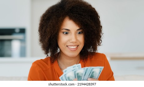 Portrait Indoors Wealthy Happy Smiling Exited Successful African American Woman Counting Dollar Money Holding Salary Credit From Bank Loan Count Cash Finance Offer Opportunity Financial Profit At