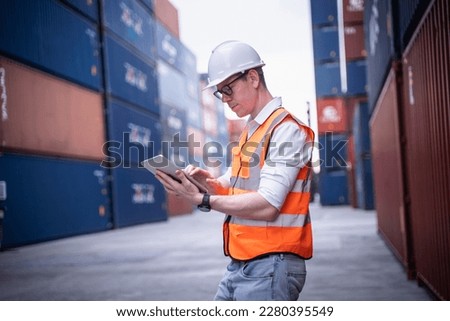 Portrait of Industrial Engineer or foreman working in container yard