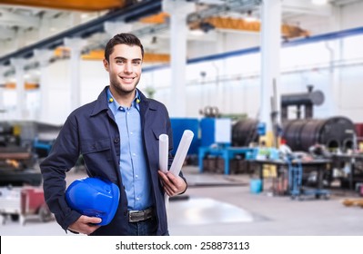 Portrait Of An Industrial Worker In A Factory