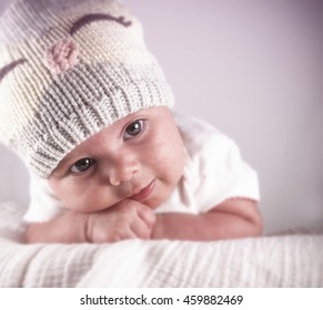 Portrait Of An Infant Girl Wearing A Winter Knit Hat With A Retro Vintage Filter App Or Action