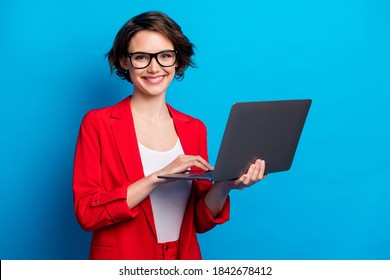 Portrait of intelligent cheerful lady skilled executive assistant holding in hand laptop working remotely isolated bright blue color background