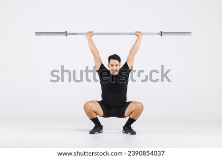 Portrait isolated cutout full body studio shot strong Asian male fitness athlete sportman model in black casual sport workout outfit posing smiling lifting barbell exercising on white background.