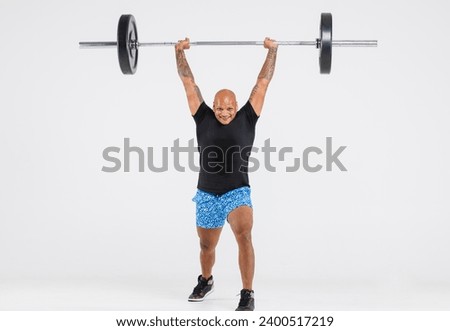 Portrait isolated cutout full body studio shot strong African American male fitness athlete sportman trainer model in casual sport workout outfit posing lifting barbell training on white background.