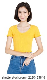 Portrait Isolated Cutout Studio Shot Of Asian Pretty Friendly Young Teenager Short Hair Girl Model In Casual Crop Top Shirt And Jeans Standing Posing Holding Hand On Head Smiling On White Background.