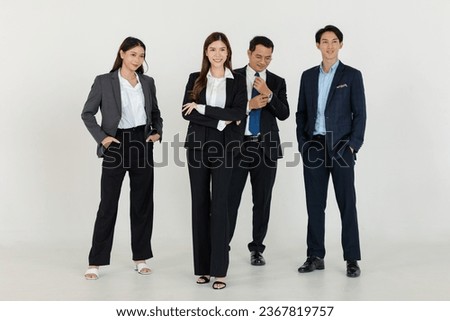 Portrait isolated cutout studio shot Asian professional successful group male female businesswomen businessmen in formal suit standing crossed arms side by side smiling together on white background.