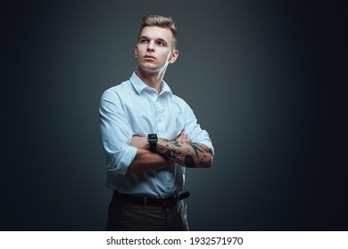 Portrait Of A Isolated In Dark Background Hipster Guy Dressed In Custom Suit. Well Dressed Macho Looks Away Posing In Studio.