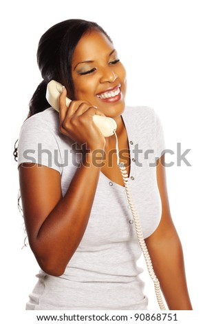 Portrait of a isolated young pretty black woman on the phone.