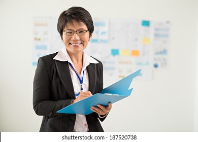 Portrait Of Japanese Business Lady With A Folder