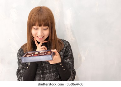 A portrait of Japanese girl have chocolate