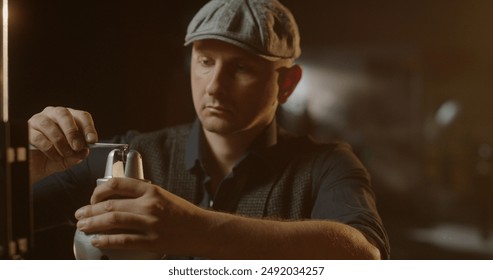 Portrait of a Jeweler Adjusting Eyepiece for Crafting a Ring in Vintage Workshop - Powered by Shutterstock