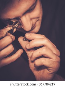 Portrait of a jeweler during the evaluation of jewels.