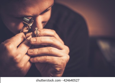 Portrait of a jeweler during the evaluation of jewels. - Shutterstock ID 424640527