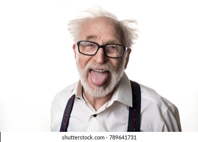 Portrait Of Jocular Aging Man With Disheveled Hair Sticking His Tongue Out In Einstein Manner. Isolated On Background