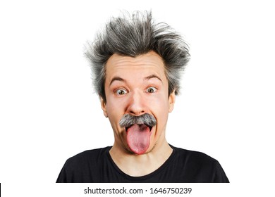 Portrait of jocular aging man with grey long hair sticking his tongue out in Einstein manner. Isolated on background.