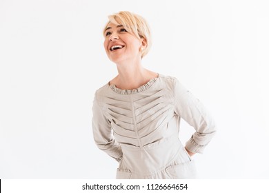 Portrait Of Joyful Blond Adult Woman 40s Looking Upward At Copyspace And Laughing Isolated Over White Background In Studio