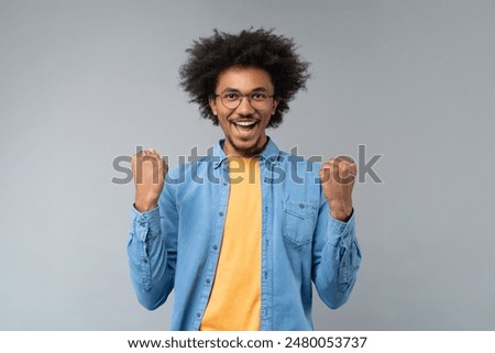 Similar – Image, Stock Photo Confident happy African American businesswoman standing against urban buildings