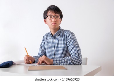 Portrait Of A Junior High School Boy In Front Of A White Wall