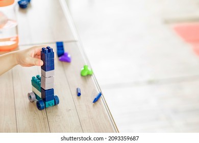 Portrait Of Kid Cute Asian Girl Playing A Blocks Plastic Game. Selective Focus. Copy Space. Executive Functions Concept.