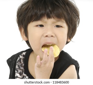 Portrait Of Kid Eating A Biscuit Over White Background