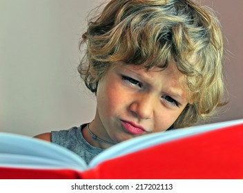 Portrait Of A Kid Reading The Book