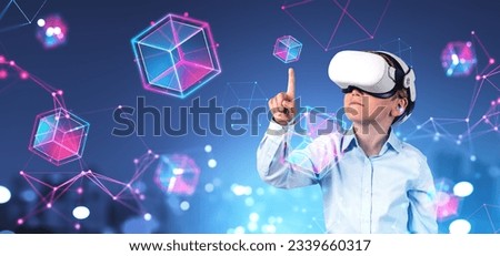 Portrait of kid schoolboy in VR virtual reality headset using immersive blockchain interface over blurry cityscape background. Concept of metaverse, cyberspace and future education