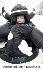 Portrait Of Kid In Sumo Suit In Winter