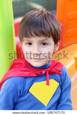 portrait of a kid with a superhero costume