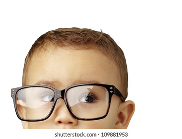 Portrait Of A Kid Wearing Glasses Against A White Background