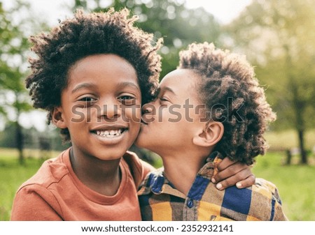 Portrait, kids and boy siblings kiss in a park for play, fun and bonding in nature together. Family, face and brothers hug, African children and happy outdoor with love, support and trust on weekend