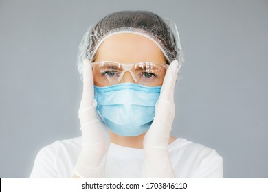 Portrait Of Laboratory Assistant Nurse Woman Wearing Medicine Protective Glasses, Face Medical Mask During Flu Covid-19 Epidemic. Doctors Clothes And Virus Protection At Coronavirus Outbreak