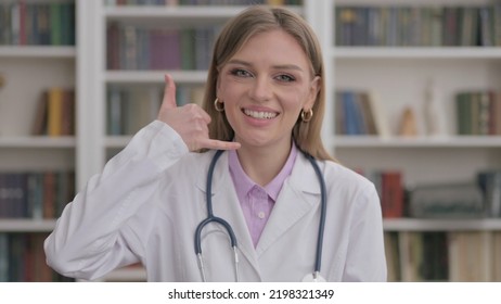 Portrait Of Lady Doctor Showing Call Me Sign