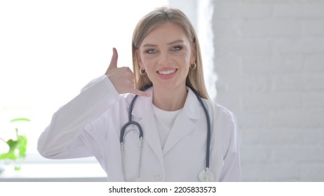 Portrait Of Lady Doctor Showing Call Me Sign