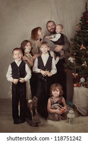 Portrait Of Large Family Near Christmas Tree