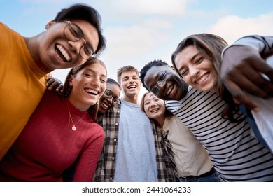 Portrait large group multiracial friends posing smiling and looking to camera. Happy young people hugging together standing outdoors. Photo of generation z guys and girls enjoying spring vacation day - Powered by Shutterstock