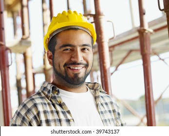 Portrait Of Latin American Construction Worker, Looking At Camera