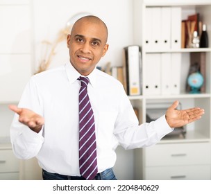 Portrait Of Latin American Man In Formal Clothes On Light Background