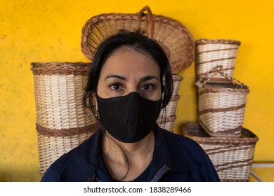 Portrait Of Latin Artisan Woman With Mask, With At Work Work Clothes