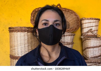 Portrait Of Latin Artisan Woman With Mask, With At Work Work Clothes