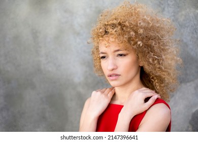 Portrait Latin Young Serious Curly Hair Woman Wearing Red Dress Outdoor