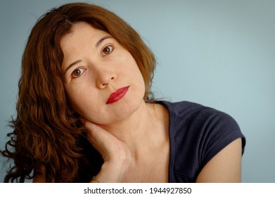 Portrait Of A Latina Woman, With Calm Expression, Looking Straig