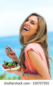 Portrait Of Laughing Girl With Green Salad At Seaside.