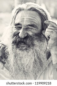 Portrait Of  Laughing Old Man With Gray Beard