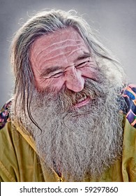 Portrait Of Laughing Old Man With Gray Beard