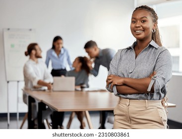 Portrait, leadership and arms crossed with a business black woman in the office for a strategy meeting. Management, smile and a happy female leader standing in the workplace with a team of colleagues