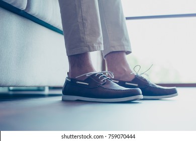 Portrait of legs with modern, fashionable men's shoes with shoelaces