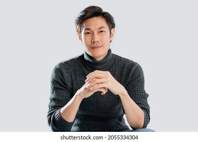 portrait lifestyle studio shot white background of young smart active asian male wear sweater smile with positive emotion and confident relax casual asian male white background