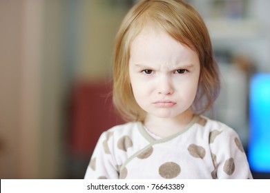 Portrait Of Little Angry Toddler Girl