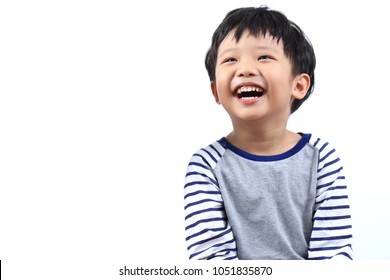 Portrait Of A Little Asian Boy Smiling And Eye Looking Up, Isolated On White Background.